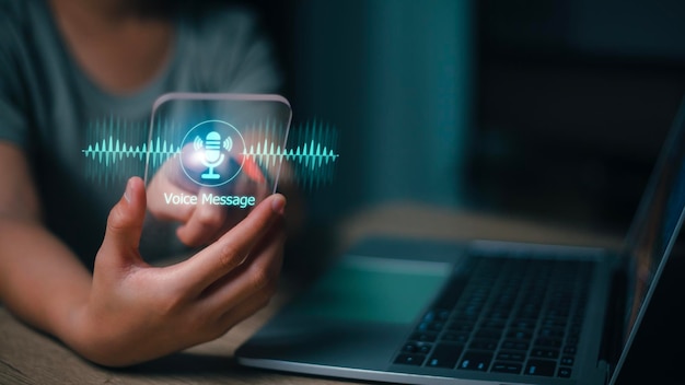 Woman recording voice message on her mobile phone All screen graphics are made up on futuristic virtual interface screen