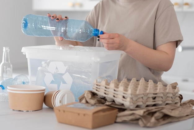 Woman recycling for a good environment