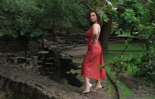 Woman in red dress in park