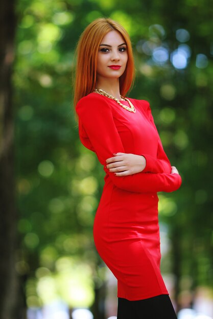 Woman in red dress on the street