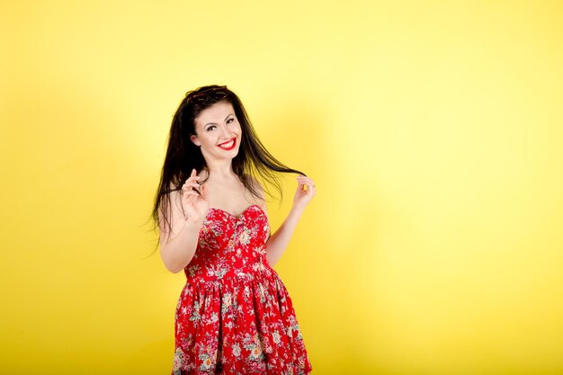 Woman in red dress on yellow