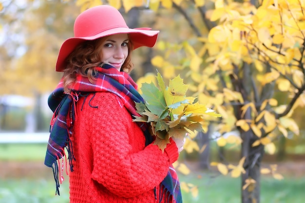 Woman in red hat autumn outdoor