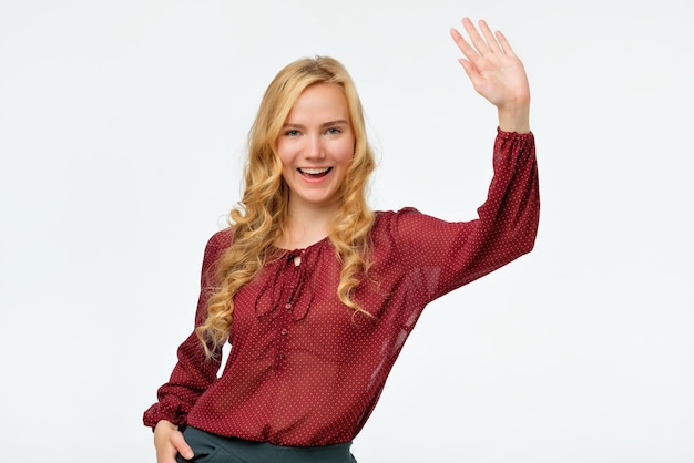 Woman in red shirt smiling and saying hello I am so glad to see you