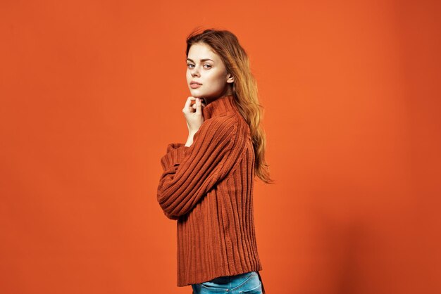 Premium Photo | Woman in red sweater fashion studio posing red background