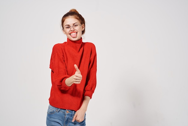 woman in a red sweater Lifestyle light background High quality photo