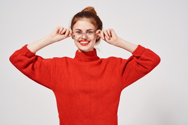 woman in a red sweater Lifestyle light background High quality photo