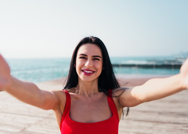 Woman in a red swimsuit on the beach