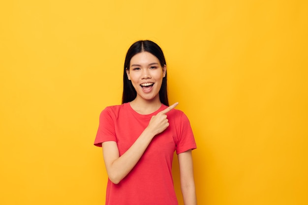 Woman in a red tshirt posing emotions fun isolated background unaltered