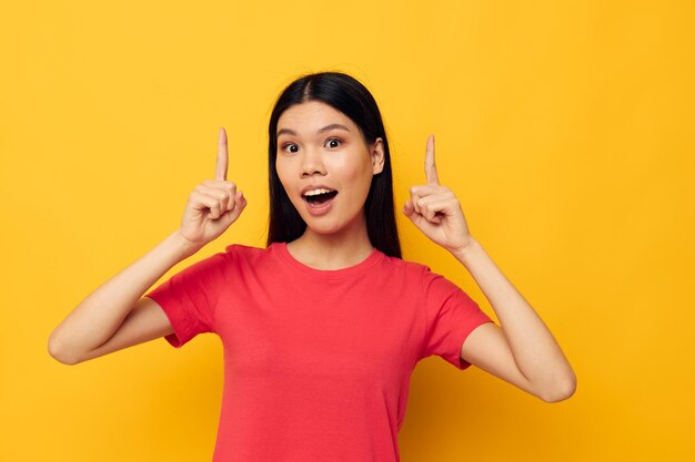 Woman in a red tshirt posing emotions fun isolated background unaltered