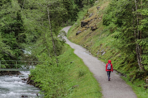 Woman in red while hiking