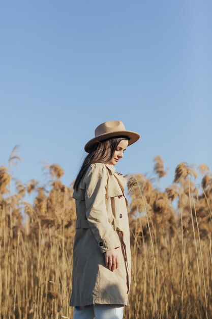 woman over reeds and blue sky