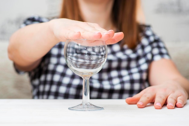 Woman refuses to drink a alcohol female alcoholism concept