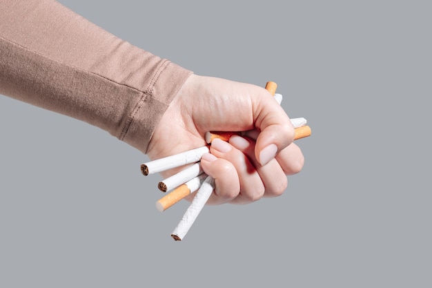 Woman refusing cigarettes concept for quitting smoking and healthy lifestyle