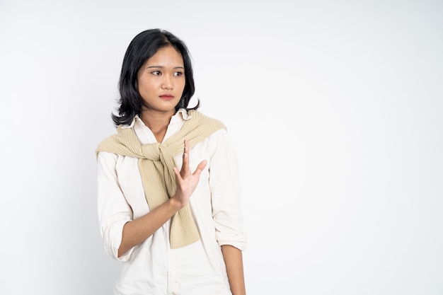 Woman refusing with both palms gesture over isolated background