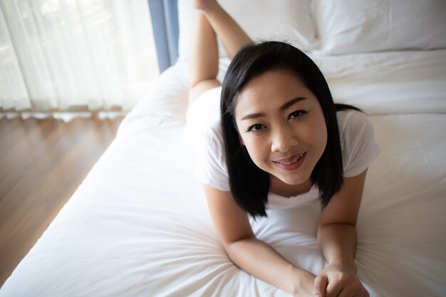 Woman relax on her bed.