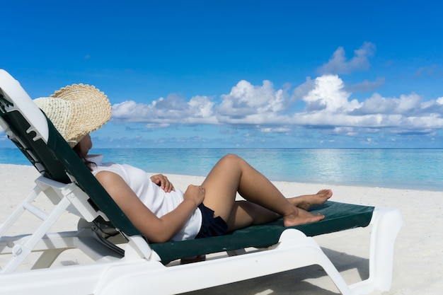 Woman in relaxation on tropical beach