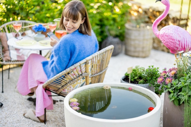 Woman relaxing at backyard during summer time