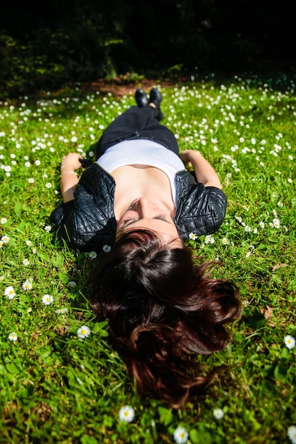 Woman relaxing on grass