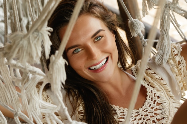 Woman relaxing in the hammock