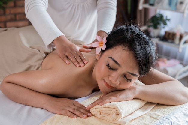 Woman relaxing on massage bed