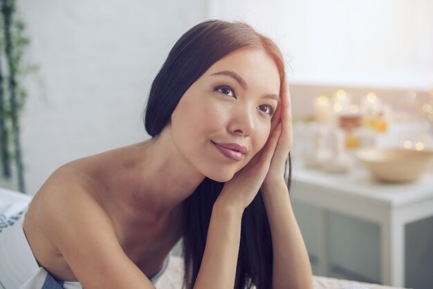Woman relaxing during a massage in a spa center. Beauty and health concept