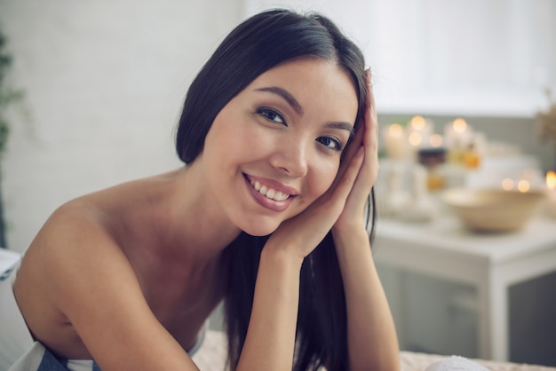 Woman relaxing during a massage in a spa center. Beauty and health concept