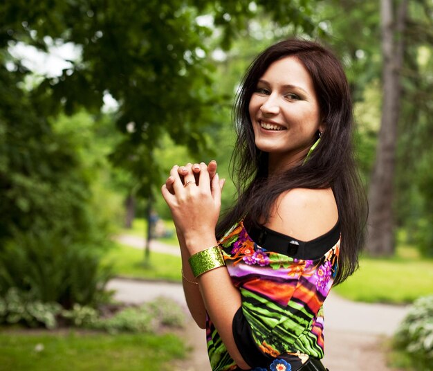 Woman relaxing outdoors smiling