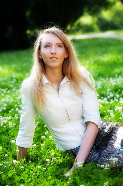 Woman relaxing outdoors smiling