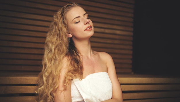 Woman relaxing in a sauna in a wellness center