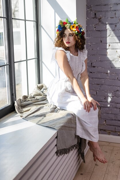 Woman relaxing sitting when she gets home in summer time