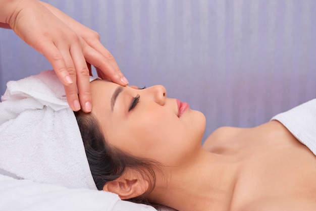 Woman relaxing at spa procedure