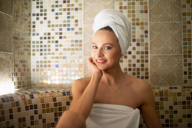 Woman relaxing in a steam bath