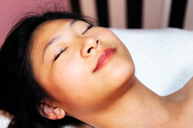 Woman relaxing with eyes closed on a beauty salon