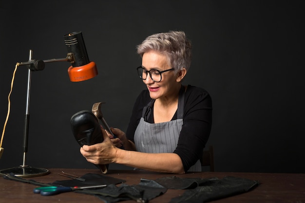 woman repairs shoe