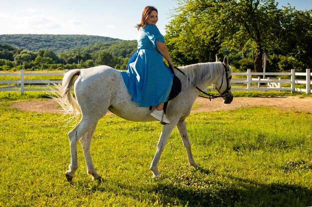 The woman restores her mental health by riding a horse