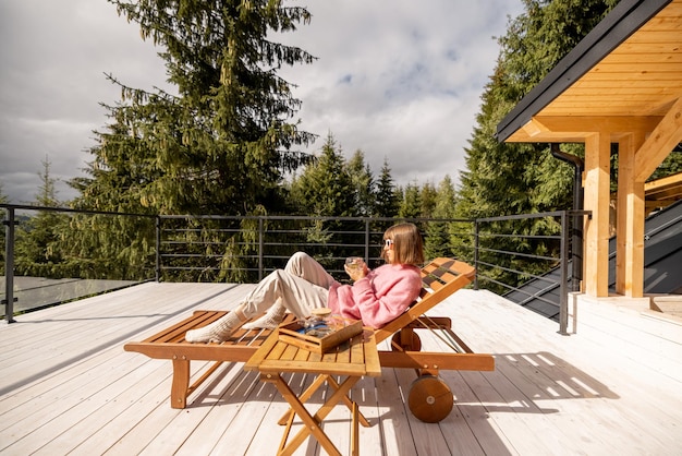 Woman rests on terrace in mountains