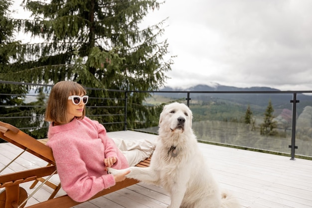 Woman rests on terrace in mountains