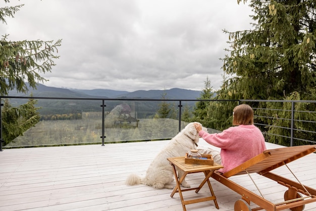 Woman rests on terrace in mountains