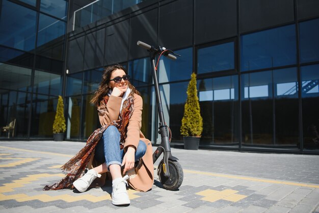 Woman riding an electric scooter outdoors