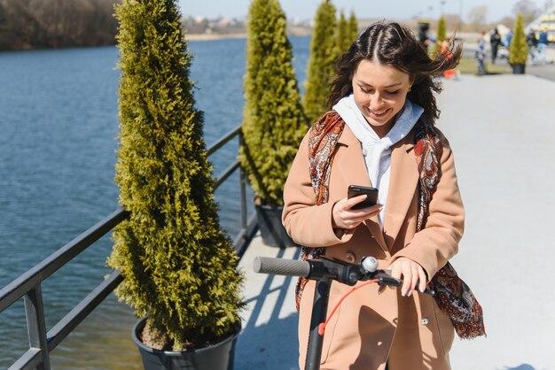 Woman riding an electric scooter outdoors