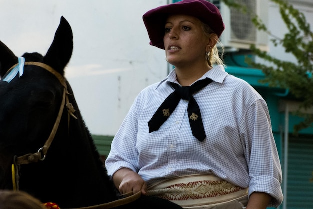 Woman riding horse in city