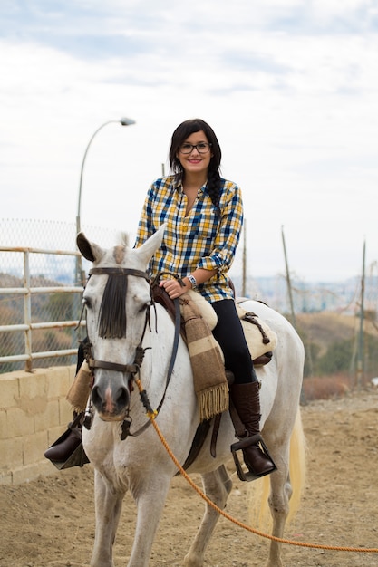 Woman riding a horse