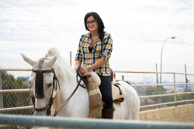 Woman riding a horse