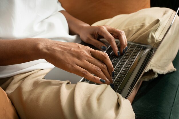 Woman&amp;rsquo;s hands typing on laptop wfh in the new normal