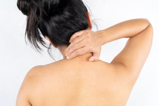 woman rubbing aching back