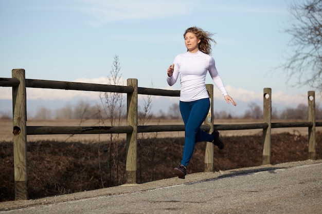 Woman running in the fields