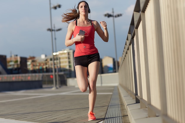 Woman running in Milan - Italy