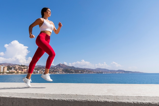 Woman running outside side view