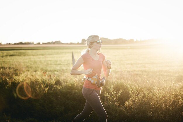 Woman running on rural fields