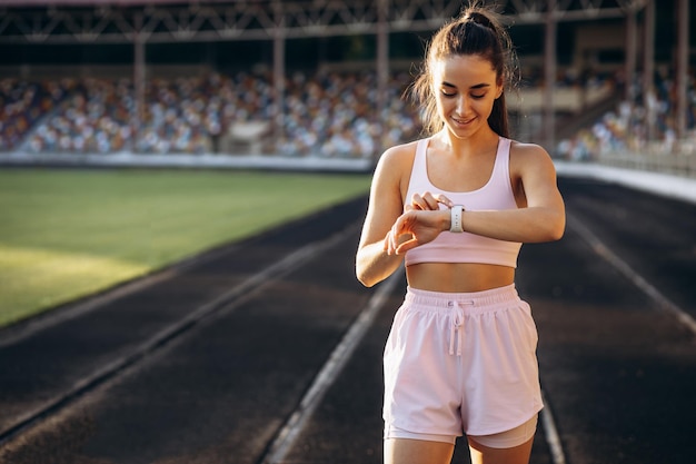 Woman running on the stadium running track